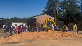 Homeless No More President and CEO Lila Anna Sauls, representatives from United Way of the Midlands and the South Carolina State Housing Finance and Development Authority, and other community leaders break ground at Grand Village in Columbia on Oct. 13.