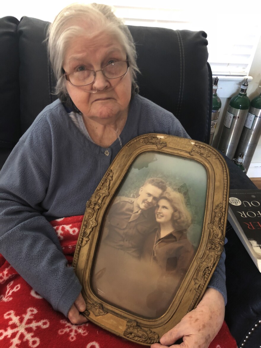 Christine Porter, 86, holds a portrait of her and her husband, Cpl. Kenneth F. Reese. He disappeared in North Korea just before Christmas 1950. Their daughter, Shelia Reese, was two months old when her father went missing.