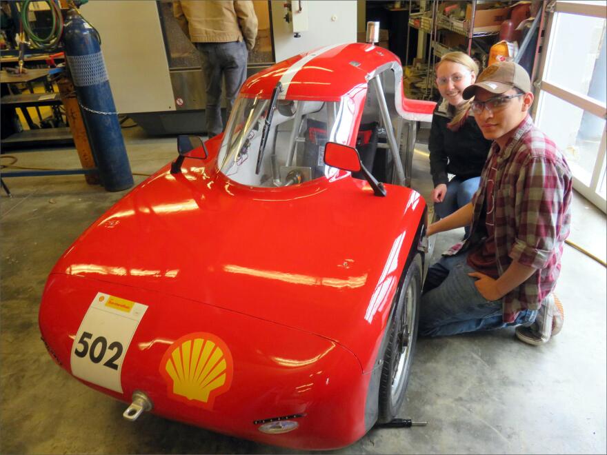 Granite Falls High School Eco Car Team drivers Kelsey and Dimitri beside their ''UrbanConcept'' vehicle. CREDIT: TOM BANSE