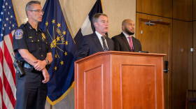 Indianapolis Mayor Joe Hogsett (center), announces reforms for IMPD with Chief Bryan Roach (left) and Deputy Mayor of Neighborhood Engagement David Hampton (right).