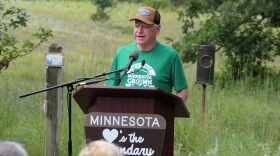 Gov. Tim Walz announces an executive order banning nonferrous mining near the Boundary Waters Canoe Area Wilderness at a news conference at the Belwin Conservancy near Afton State Park on Aug. 18, 2026.
