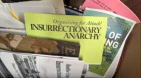 One of the defendants was charged with evidence tampering and conspiracy to tamper with evidence for attempting to get rid of documents related to the shooting at the Prairieland Detention Center. Court records say the box the defendant left at a Denton apartment contained antigovernment propaganda.