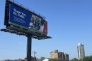 A billboard above Interstate 65 in downtown Louisville.