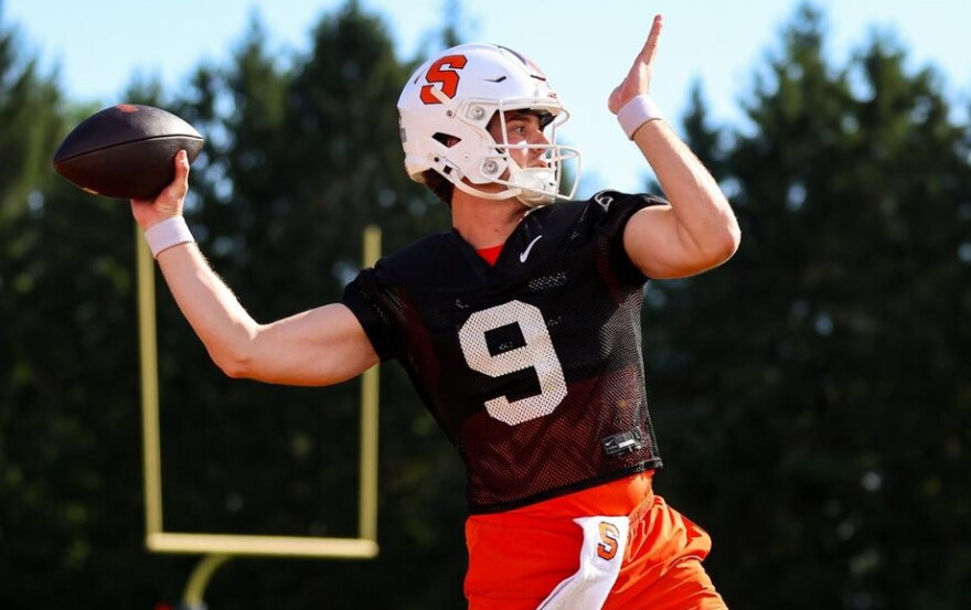 Syracuse starting quarterback Steve Angeli (9, Black) throws in a fall practice.