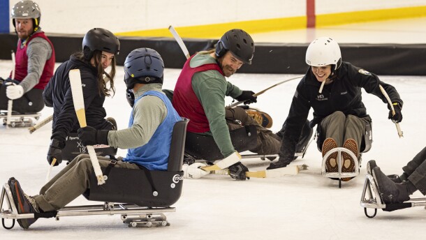 A group of firefighters plays sled hockey during Higher Ground's recent recreation therapy program in Sun Valley