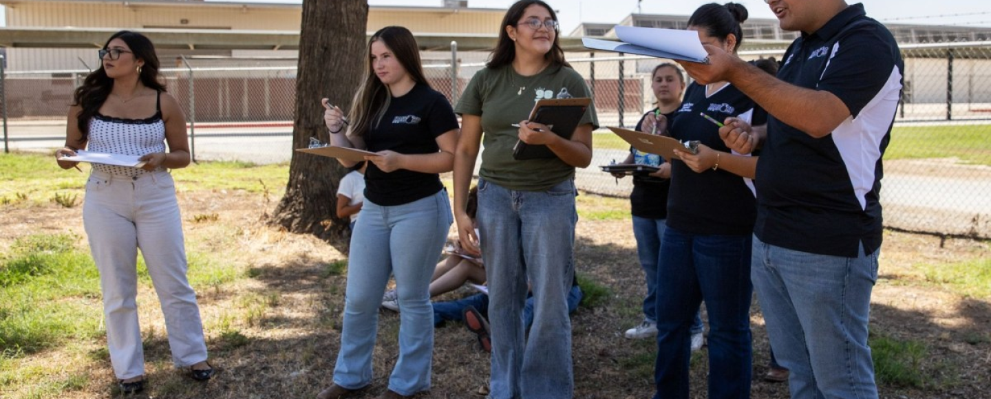 Hanford High honors agriculture students are shown sketching out plans for a monarch butterfly mural at their on-campus farm.