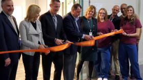 Indiana Department of Corrections and Televerde officials cut a ribbon to celebrate the opening of a new call center at Madison Correctional Facility.