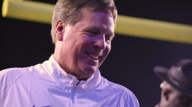 Florida head coach Jim McElwain smiles going into the locker room at halftime with his team up 34-13.