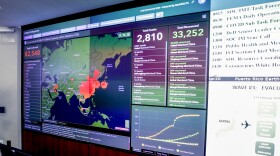 A monitor displaying a map of Asia and a tally of total coronavirus cases, deaths, and recovered, at the Secretary's Operations Center following a coronavirus task force meeting at the Department of Health and Human Services, Feb. 27, in Washington, D.C.