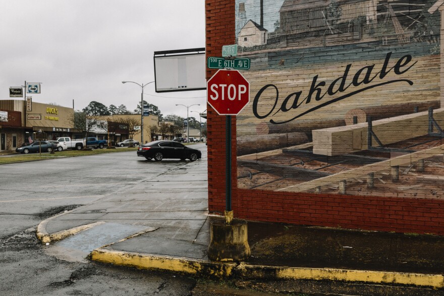 A mural on an empty commercial building in downtown Oakdale reflects the small town's logging history.