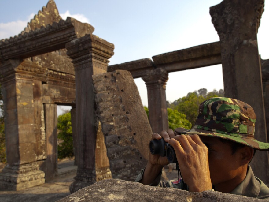 A Cambodian soldier looks across at the Thai border from the ancient Preah Vihear temple complex in Feb. 2011.