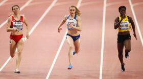 Krystsina Tsimanouskaya of Belarus, Beth Dobbin of Great Britain and Schillonie Calvert-powell of Jamaica compete in the Women's 200 metres heats.