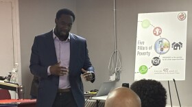 Illinois Justice Project Director Ahmadou Dramé explains the Home for Good program at Project Now's "lunch and learn" at Grace City Church in Rock Island, IL on Wednesday, April 22.