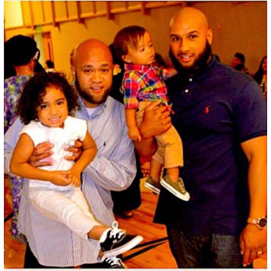 A photo of Ray Tuineau, his niece, nephew and brother A.J.