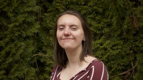 Ember Braun is looking toward the camera and smiling.