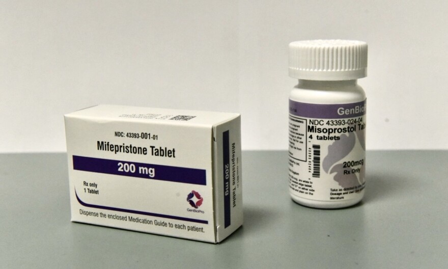 A white box with purple accents that reads Mifepristone Tablet, 200 mg.