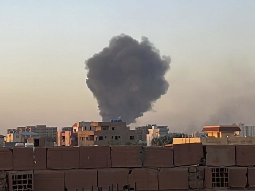 In this photo provided by Maheen S, smoke fills the sky in Khartoum, Sudan, near Doha International Hospital on Friday.