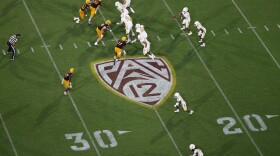 This Thursday, Aug. 29, 2019, file photo, shows the Pac-12 logo during the second half of an NCAA college football game between Arizona State and Kent State, in Tempe, Ariz.