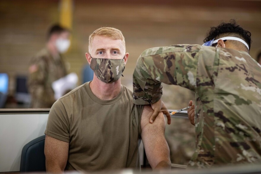 Col. Joshua Bookout, commander, 3rd Infantry Brigade Combat Team, 25th Infantry Division receives the Pfizer-BioNTech COVID-19 vaccine at the Conroy Bowl on Schofield Barracks, Hawaii on Jan. 14, 2021.