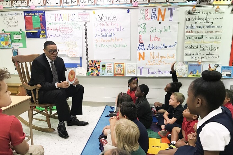 IPS Superintendent Lewis Ferebee reads to students.
