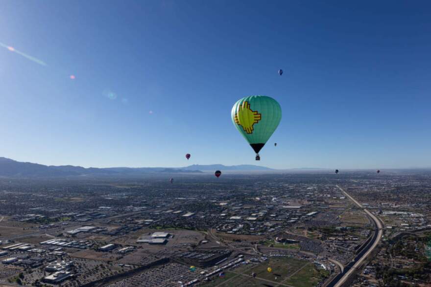 Balloonists dot the Albuquerque sky over 1500 feet above ground level. Bryce Dix/KUNM)