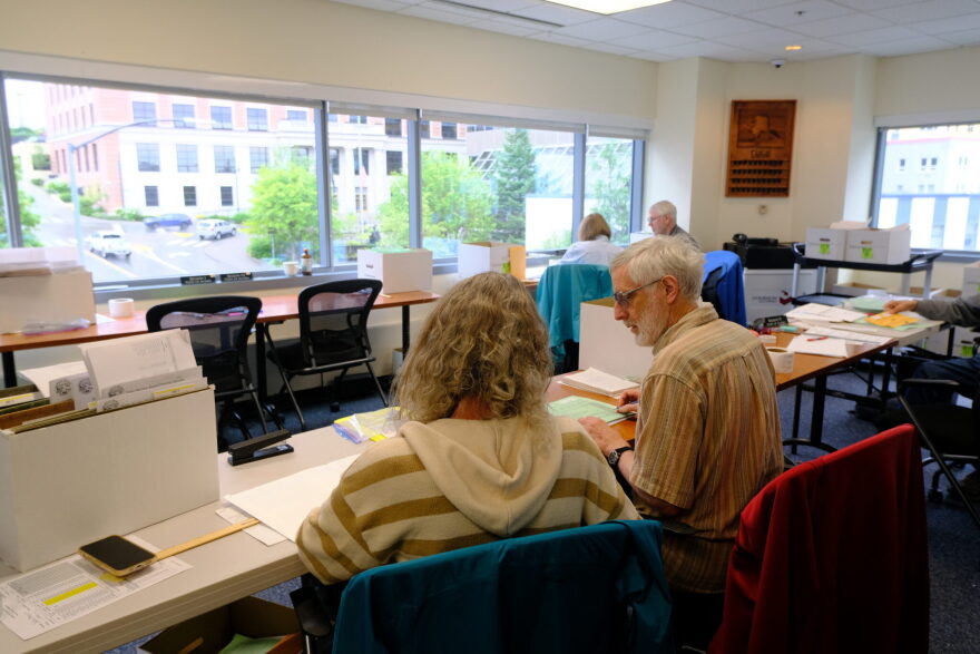 Members of the Alaska State Review Board are seen reviewing precinct ballot counts following the primary election on Aug. 26, 2026.