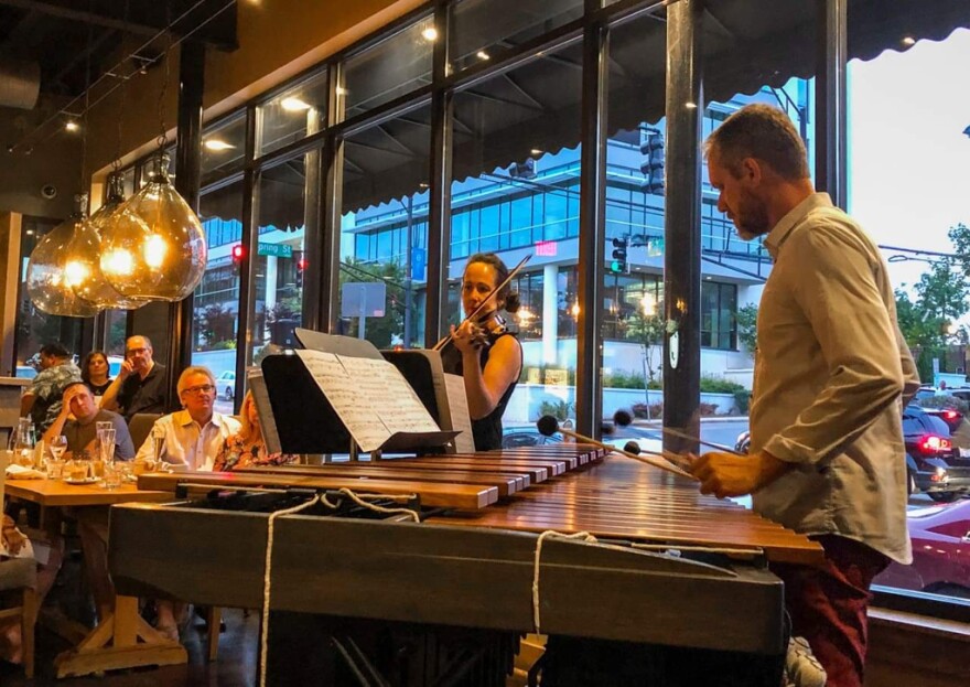 color photo of vioinist Rebecca Willie and percussionist Eric Willie in performance