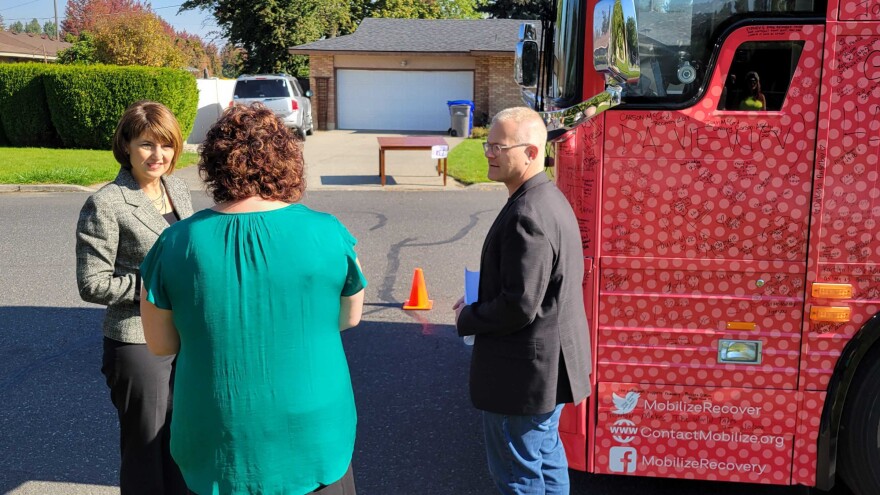 Addiction activist Ryan Hampton, right, meets with Republican Rep. Cathy McMorris Rogers, left, during a stop in Spokane, Wash.