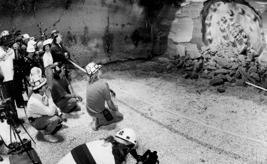 140 feet below San Antonio, a boring machine breaks through to complete the tunnel