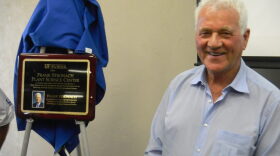 Canadian entrepeneur Frank Stronach stands next to a special plaque unveiled for him at the dedication ceremony at the University of Florida's Plant Science Center near Citra.