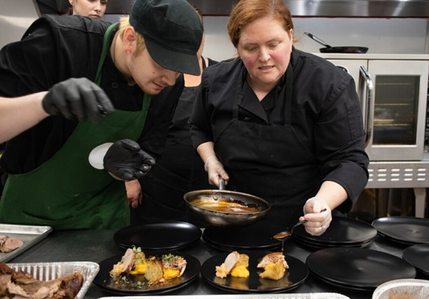 Sous Chef Harry Gavens and owner-chef Lindsay McGrail plate the second course at a fall prix fixe dinner hosted by Green Zebra.