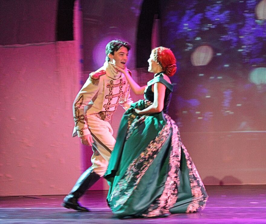 Prince Hans of the Southern Isle (Landon Maas) shares a dance at Elsa's coronation with Princess Anna (Shennan Nelson) during 'Love Is an Open Door.'