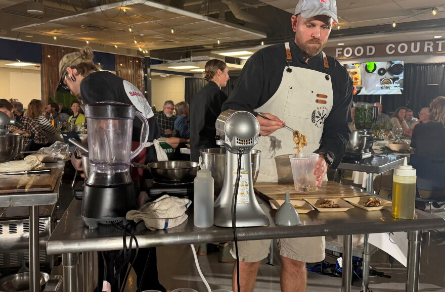Chef Aaron Gardner prepares his entrées for the judges.