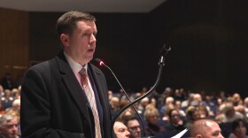 Lackawanna County Commissioner Bill Gaughan addresses Archbald borough council and representatives for a data center developer during a zoning hearing at Valley View High School.