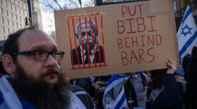 Demonstrators gather near Downing Street ahead of the arrival of Israeli prime minister Benjamin Netanyahu in London, England.