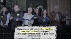 screenshot of tv ad with people at ribbon cutting with text over screen