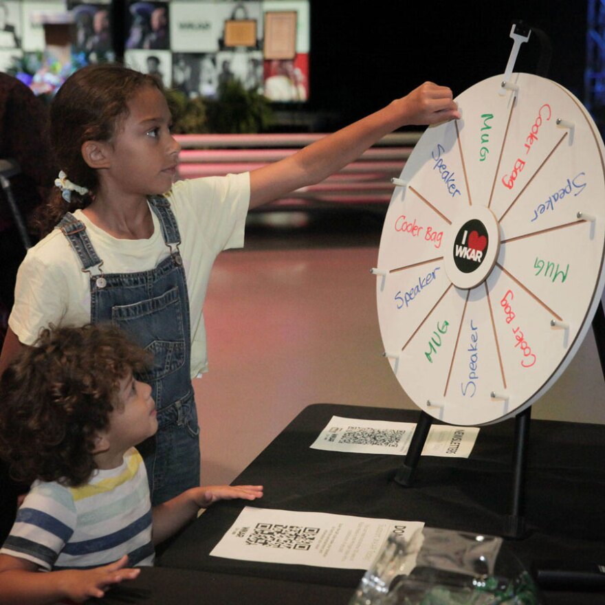Tour guests spin for prizes