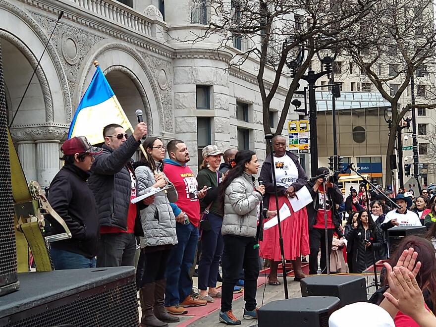 After the march, Christine Neumann-Ortiz of Voces de la Frontera, speaks to the crowd during a rally outside the Federal Courthouse in Milwaukee.