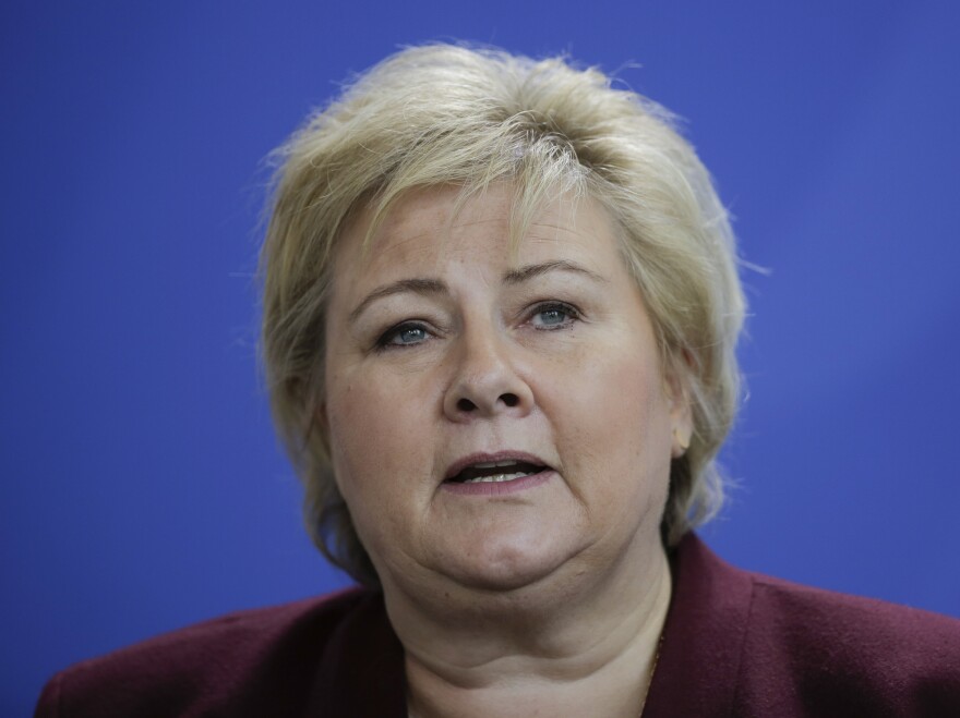 Norwegian Prime Minister Erna Solberg speaks during a joint statement with German Chancellor Angela Merkel on Tuesday. The following day, Solberg apologized to the "German girls" who faced government retaliation for their relationships with occupying German forces during World War II.
