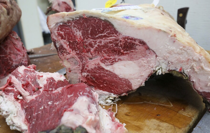 Freshly cut beef is seen in a refrigerated display case in Wilmette, Ill.