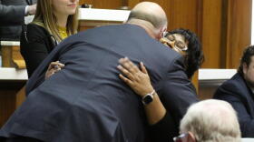 Rep. Brian Bosma (R-Indianapolis) and Rep. Cherrish Pryor (D-Indianapolis) embrace on the House floor.