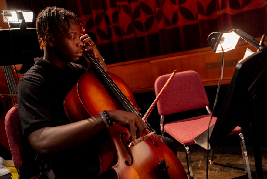 Ahmad Smith, a 15-year-old junior at Normandy high School, plays the cello on Tuesday, Nov. 29, 2022, before a performance of “The Big Bad Day,” an original opera written by Jefferson School third graders, at the Touhill Performing Arts Center.