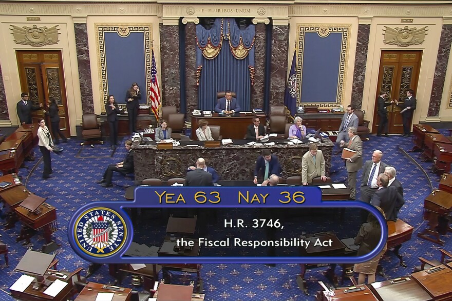 In this image from Senate Television, the final vote of 63-36 shows passage of the bill to raise the debt ceiling Thursday night, June 1, 2023, in the Senate at the Capitol in Washington. President Joe Biden is expected to quickly sign the bill that will stave off default.
