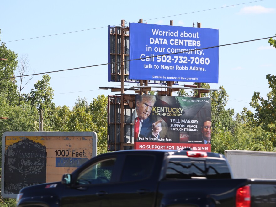 A billboard in Carrollton, Ky, urges community members concerned about data centers to contact the mayor.