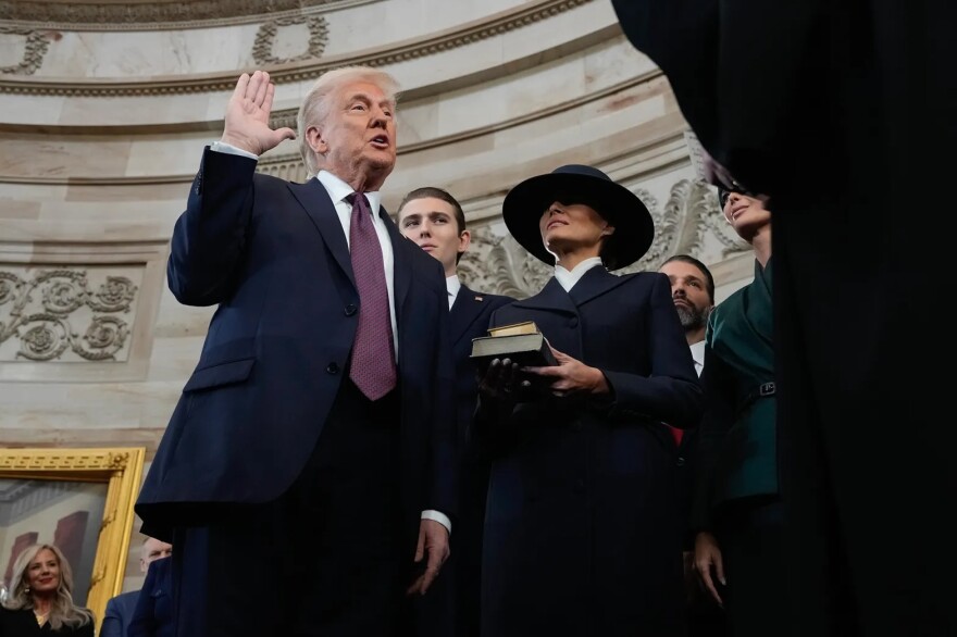 Donald Trump is sworn in as the 47th president of the United States by Chief Justice John Roberts as Melania Trump holds the Bible during the 60th Presidential Inauguration in the Rotunda of the U.S. Capitol in Washington, on Jan. 20, 2025.