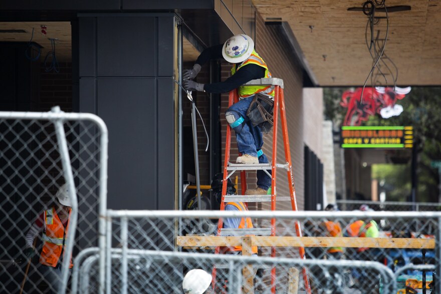 A construction worker at a building site at Trinity and Cesar Chavez in downtown Austin on March 23, 2020.