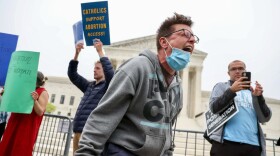 Jessica Golibart, a Washington, D.C., resident, protests outside the U.S. Supreme Court on Tuesday, May 3.