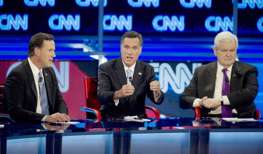 Presidential candidates Rick Santorum, left, Mitt Romney, center, and Newt Gingrich during a debate in February of 2012.