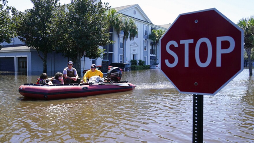 University of Central Florida students are evacuated after their apartment complex near the campus was totally flooded by rain from Hurricane Ian, Friday, Sept. 30, 2022, in Orlando, Fla.
