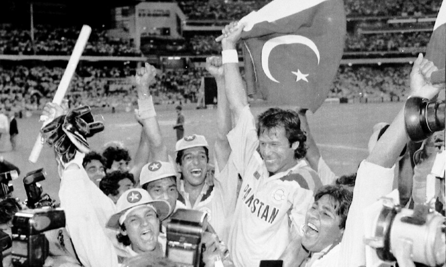 As Pakistan's cricket team captain, Imran Khan is cheered by his teammates after Pakistan defeated England in the World Cup Cricket final, in Melbourne, Australia, in 1992.